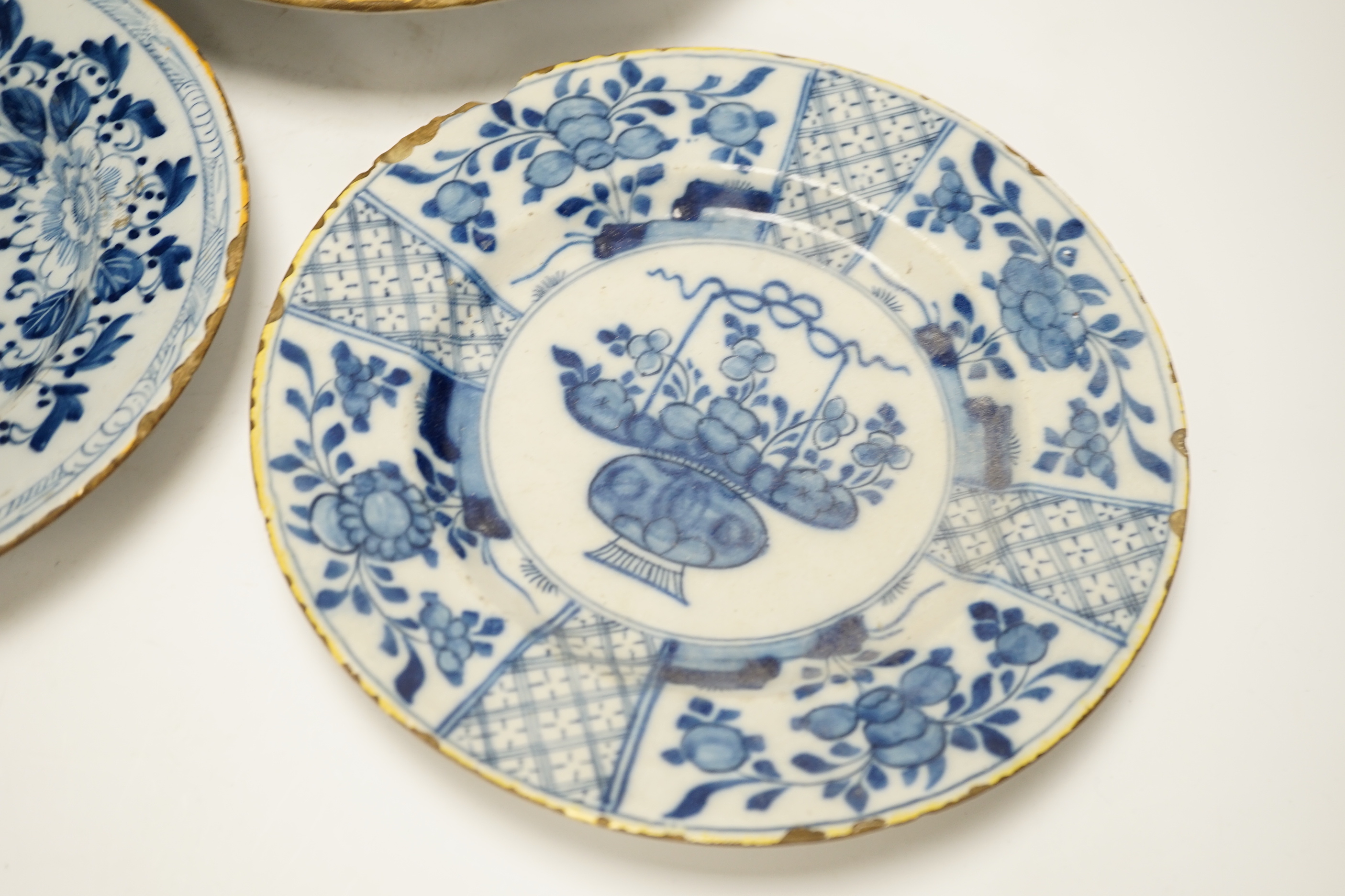 Three 18th century Delft blue and white floral dishes, 26cm in diameter